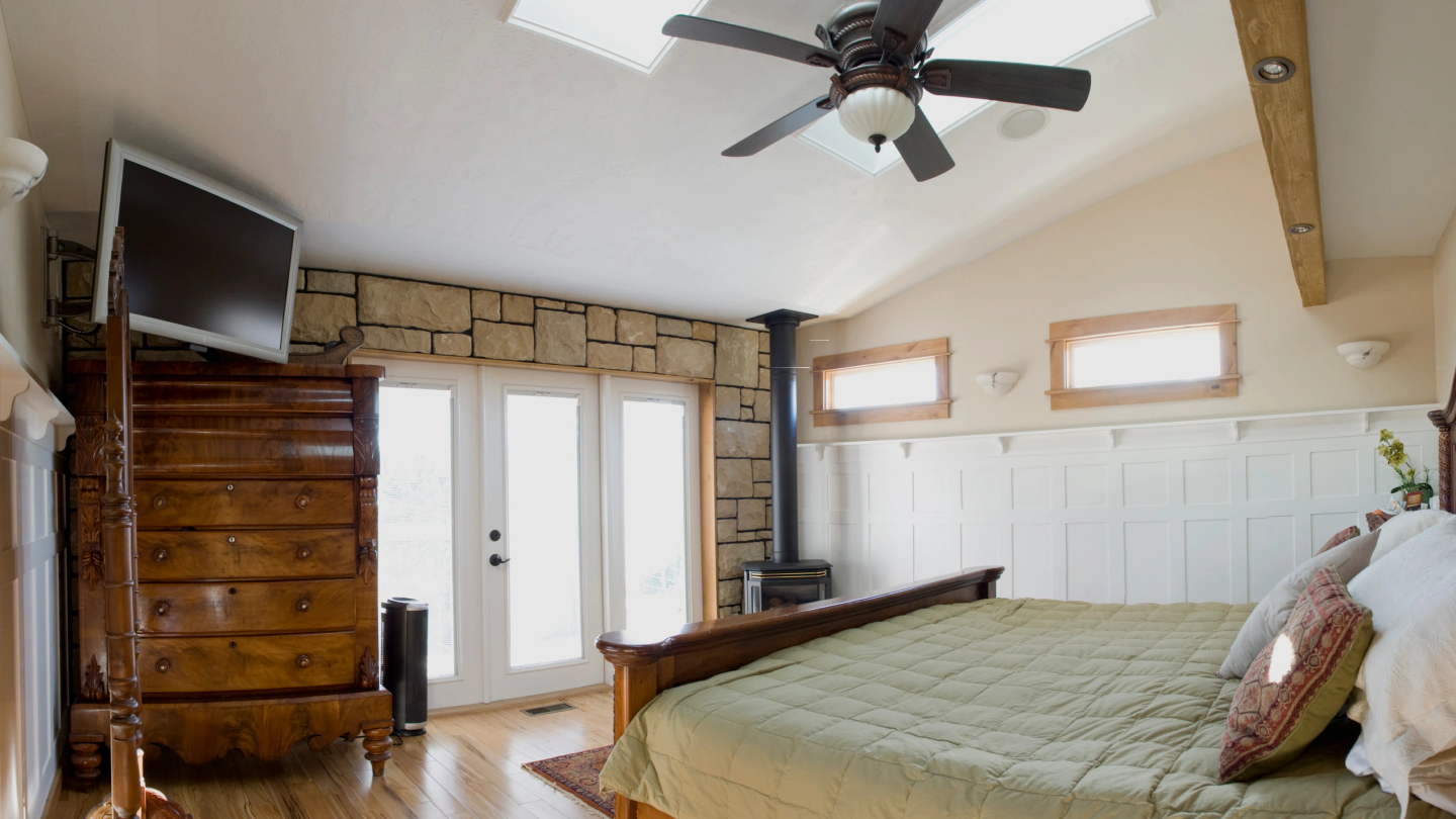 bedroom with skylight nice flooring and stone paver wall prescott az